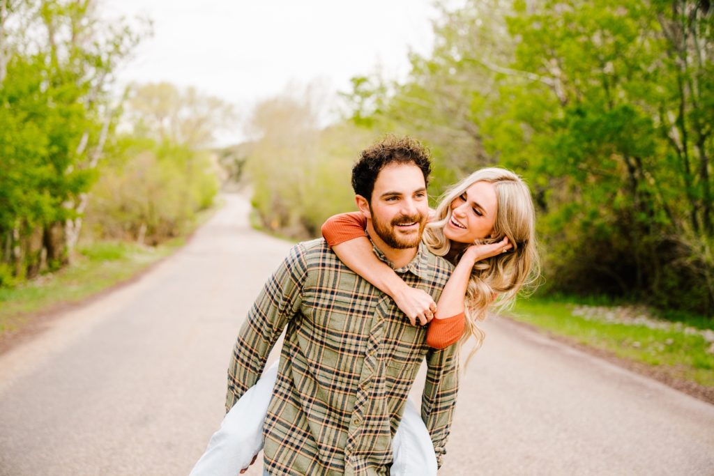 Jackson Hole wedding photographer captures Couple laughing during fun engagement sessions