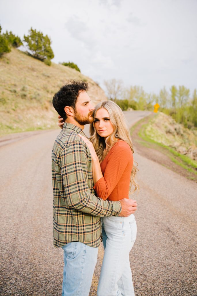 Jackson Hole wedding photographer captures man kisses woman on head