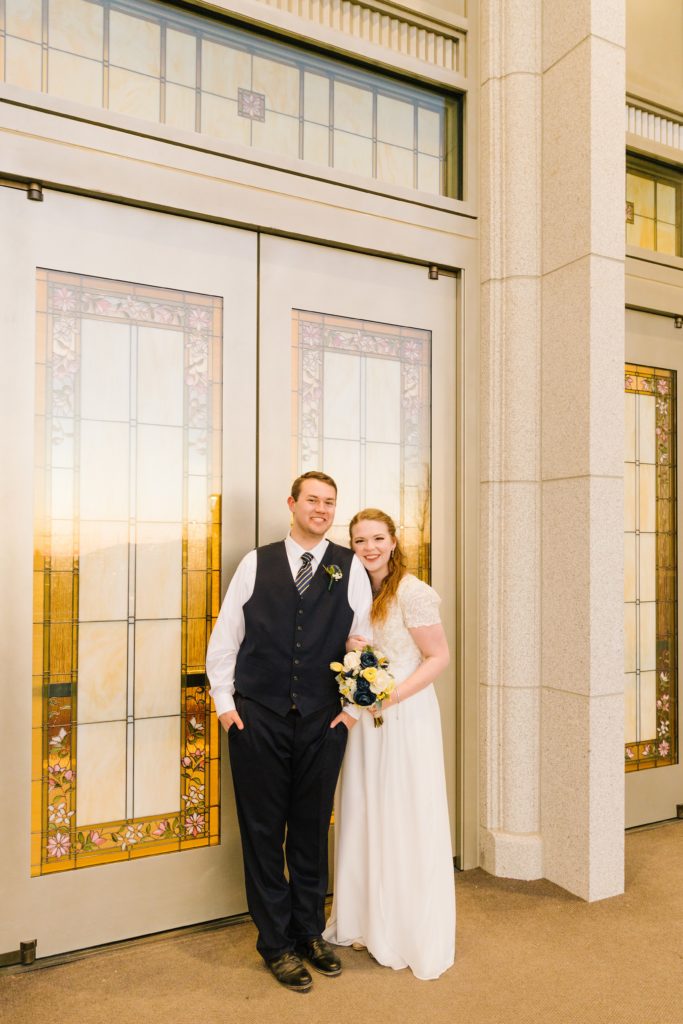 Jackson Hole wedding photographer captures LDS couple smiling at temple in pocatello Idaho