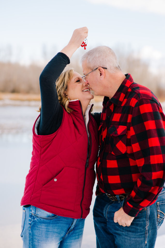 Jackson Hole wedding photographer captures kissing under mistletoe rigby photographer