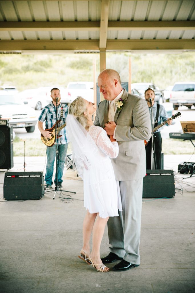 Jackson Hole wedding photographer captures Bride and groom dancing at their outdoor pocatello wedding venue