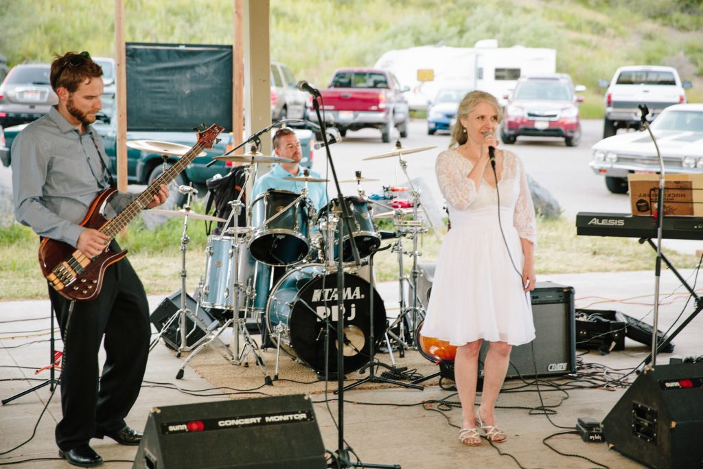 Jackson Hole wedding photographer captures Bride singing to groom on wedding day