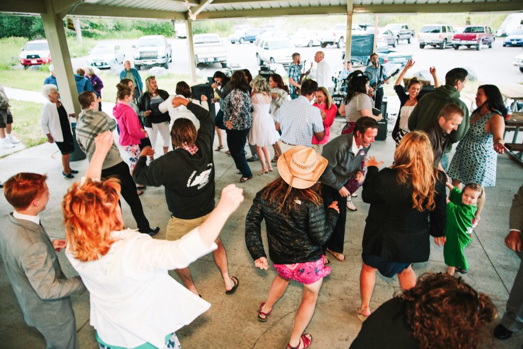 Jackson Hole wedding photographer captures Guests dancing at outdoor pocatello wedding