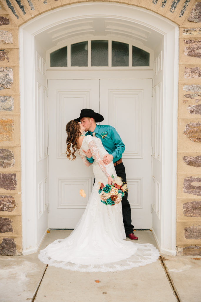bride and groom kissing for their fall wedding in Logan Utah
