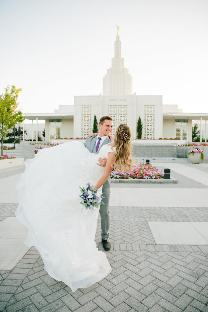 Jackson Hole wedding photographer captures groom holding bride
