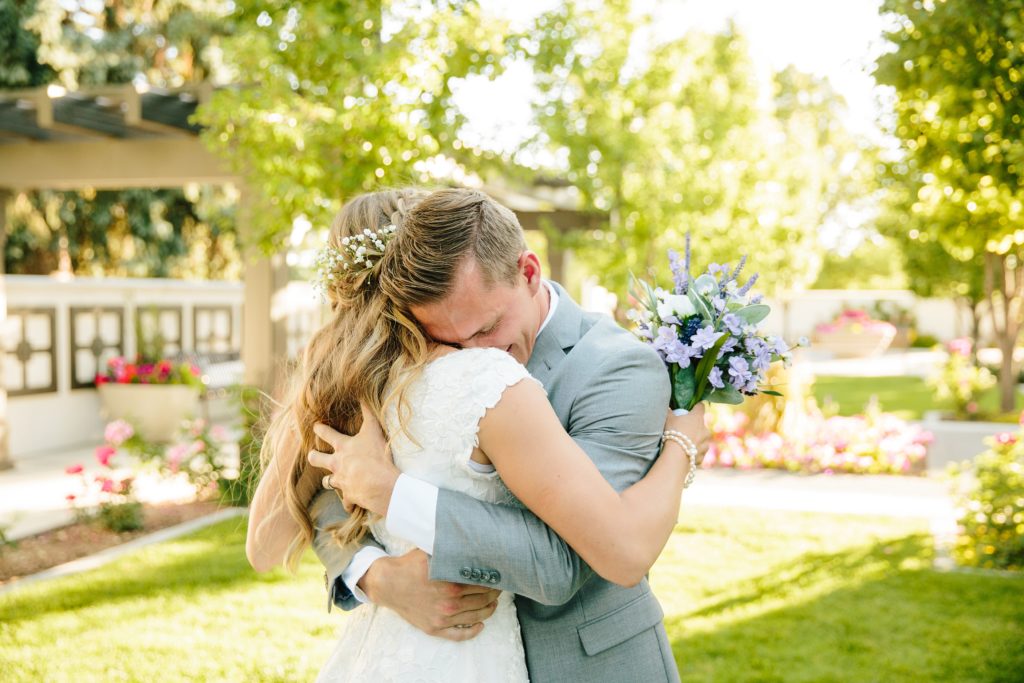 Jackson Hole wedding photographer captures groom hugging bride