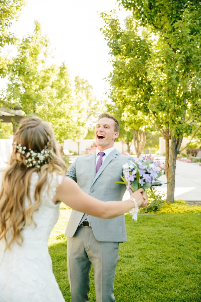 Jackson Hole wedding photographer captures groom seeing bride in dress