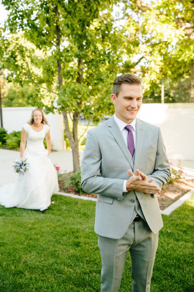 Jackson Hole wedding photographer captures bride sneaking up behind groom