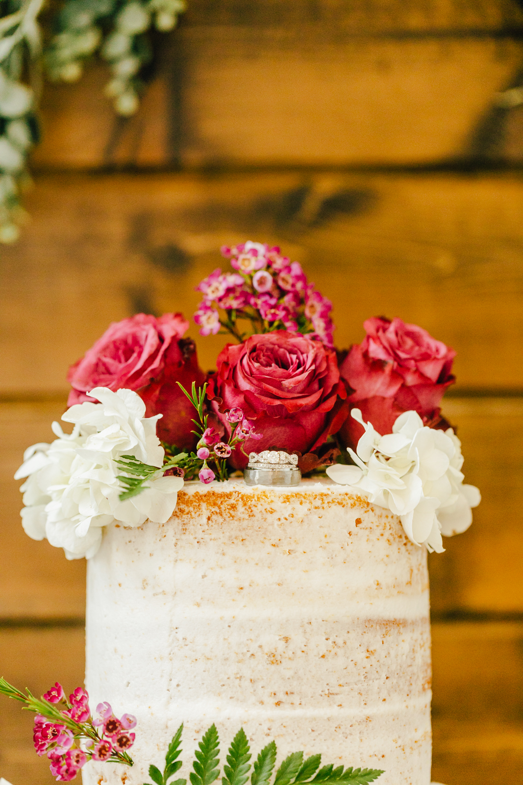 pink and red floral wedding cake topper captured by Pocatello wedding photographer 