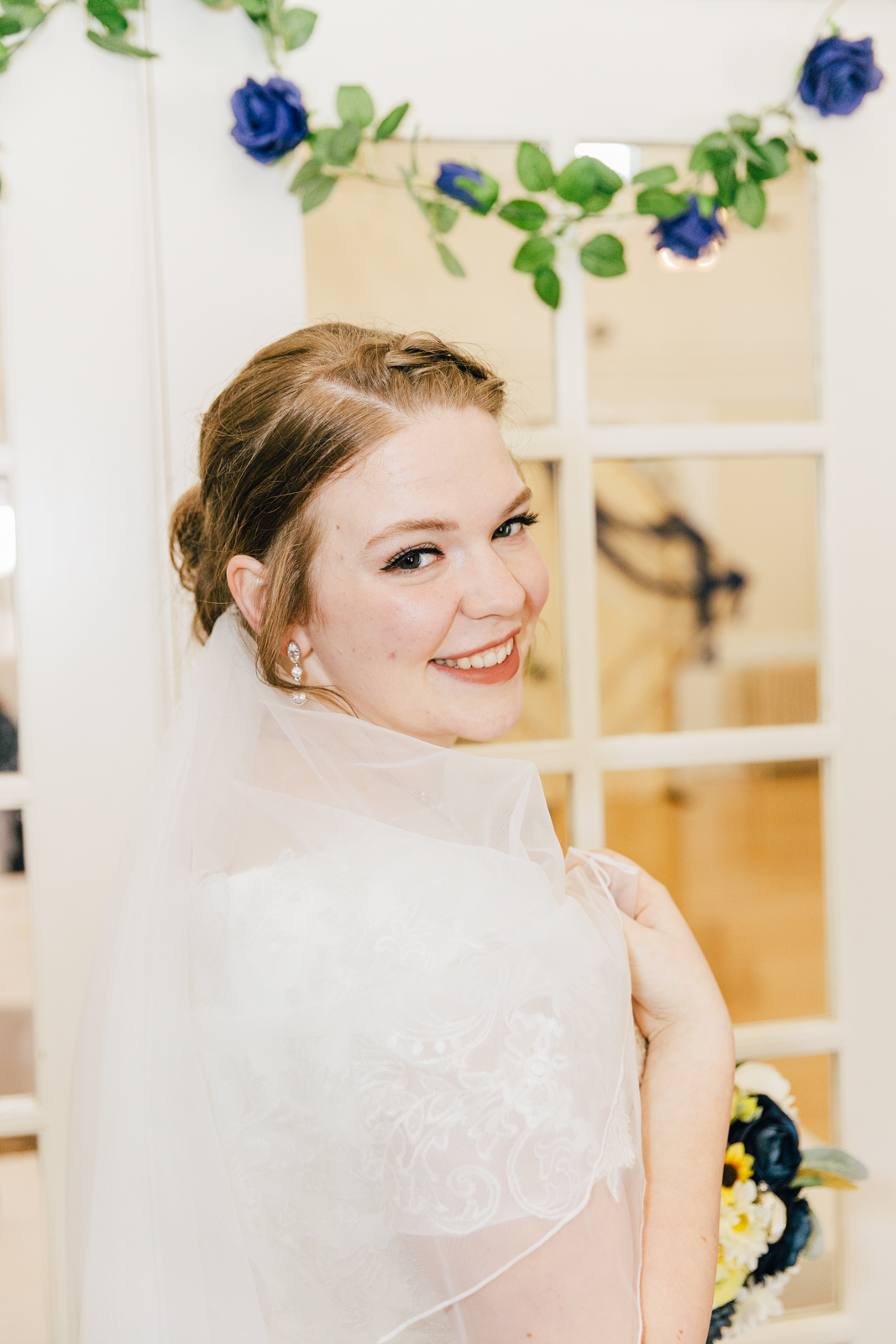 Jackson Hole wedding photographer capturesbride looking over shoulder