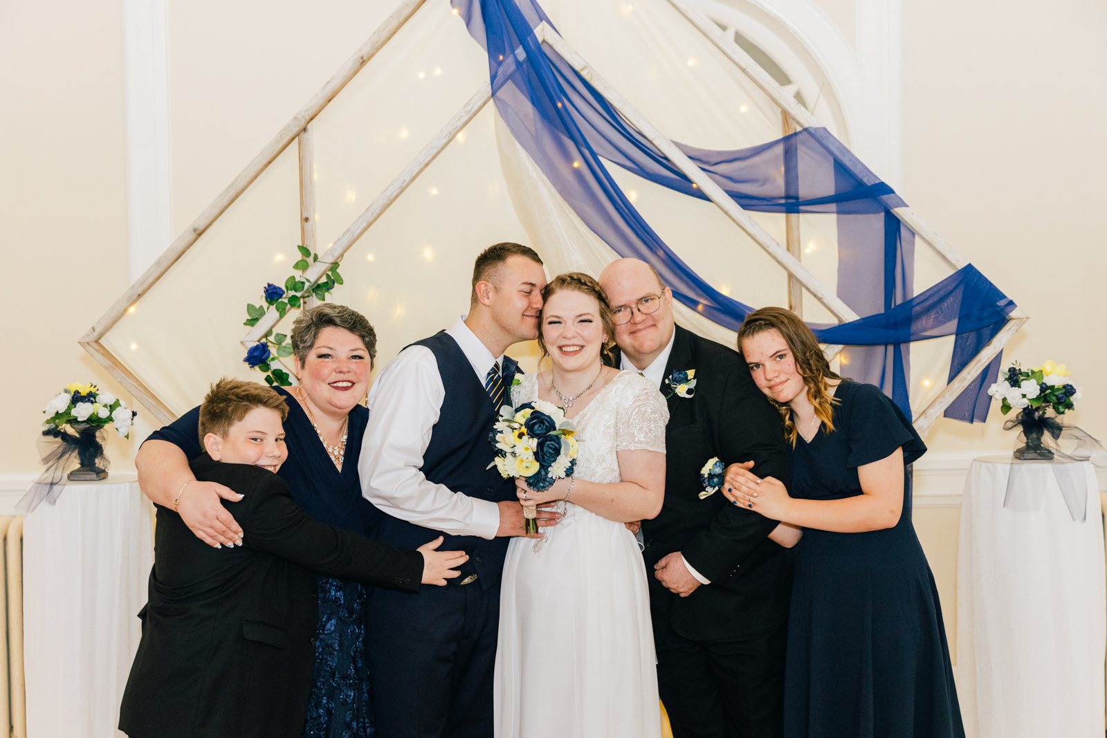 Jackson Hole wedding photographer captures brides family hugging