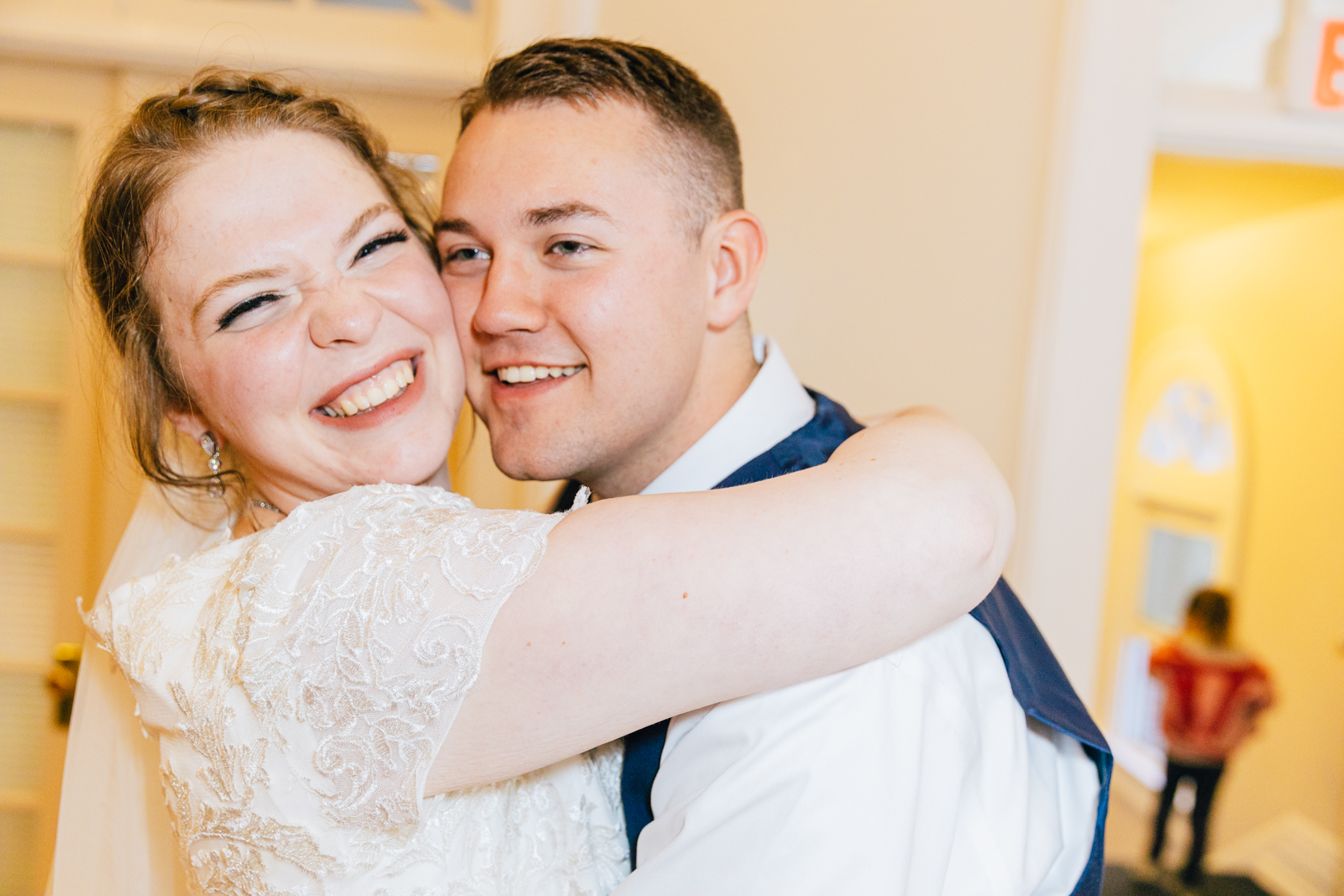 bride and groom hugging at indoor pocatello wedding reception