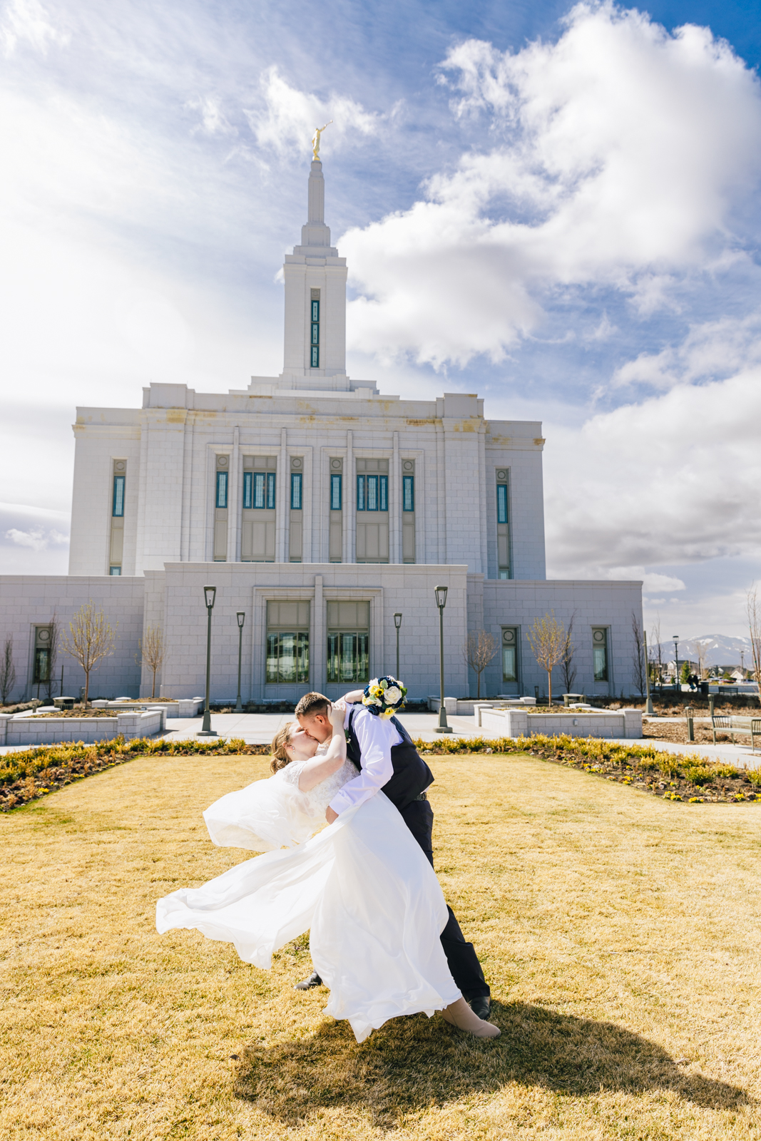 Jackson Hole wedding photographer captures couple embracing at temple 