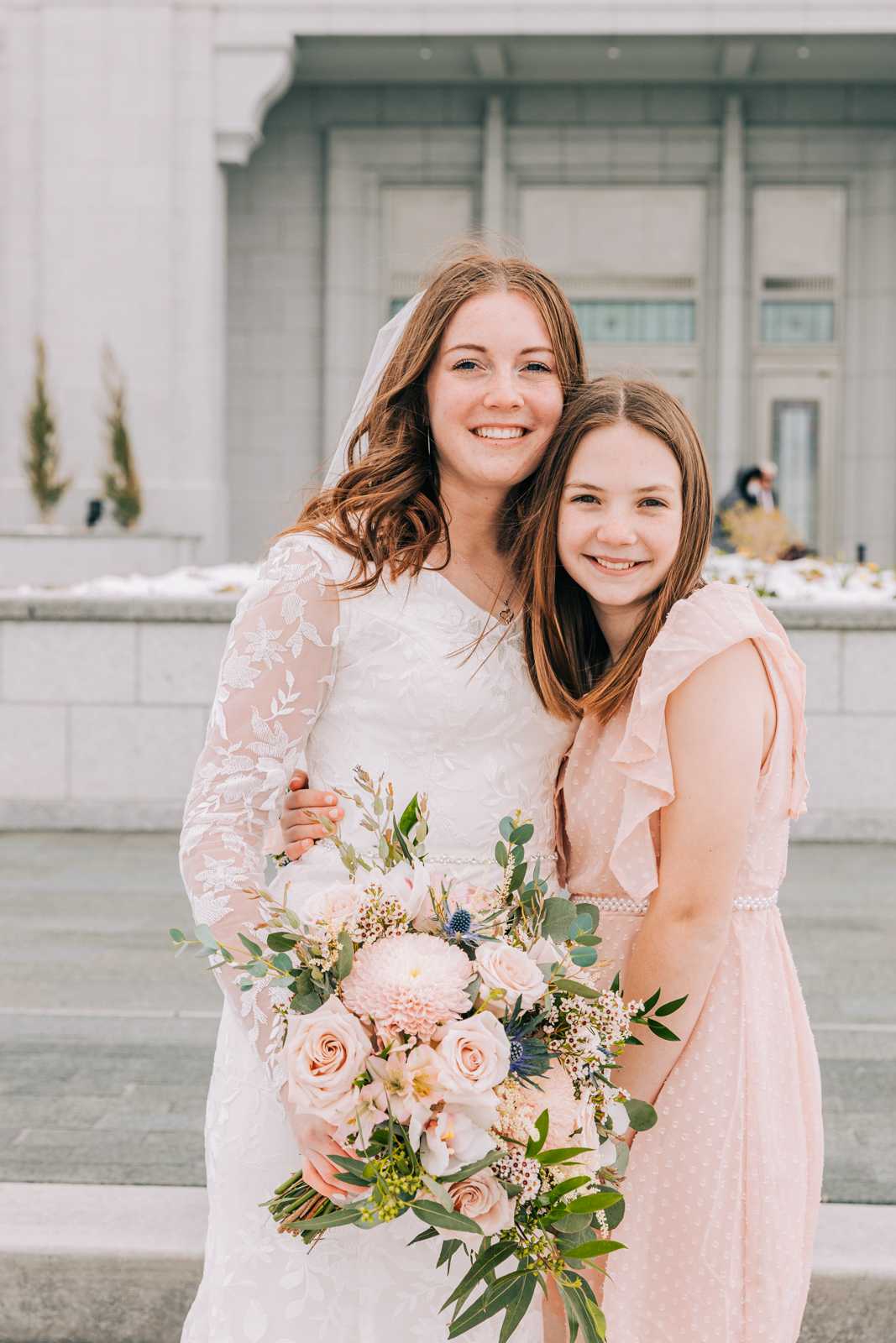 Jackson Hole wedding photographer capturesbride and little sister