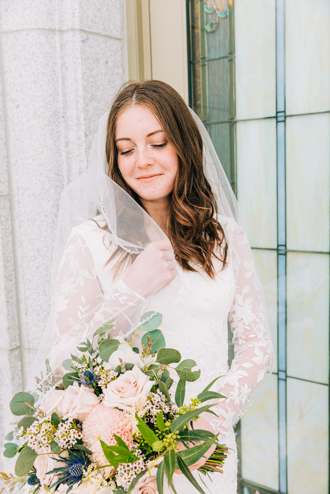Jackson Hole wedding photographer captures bride with flower by LD