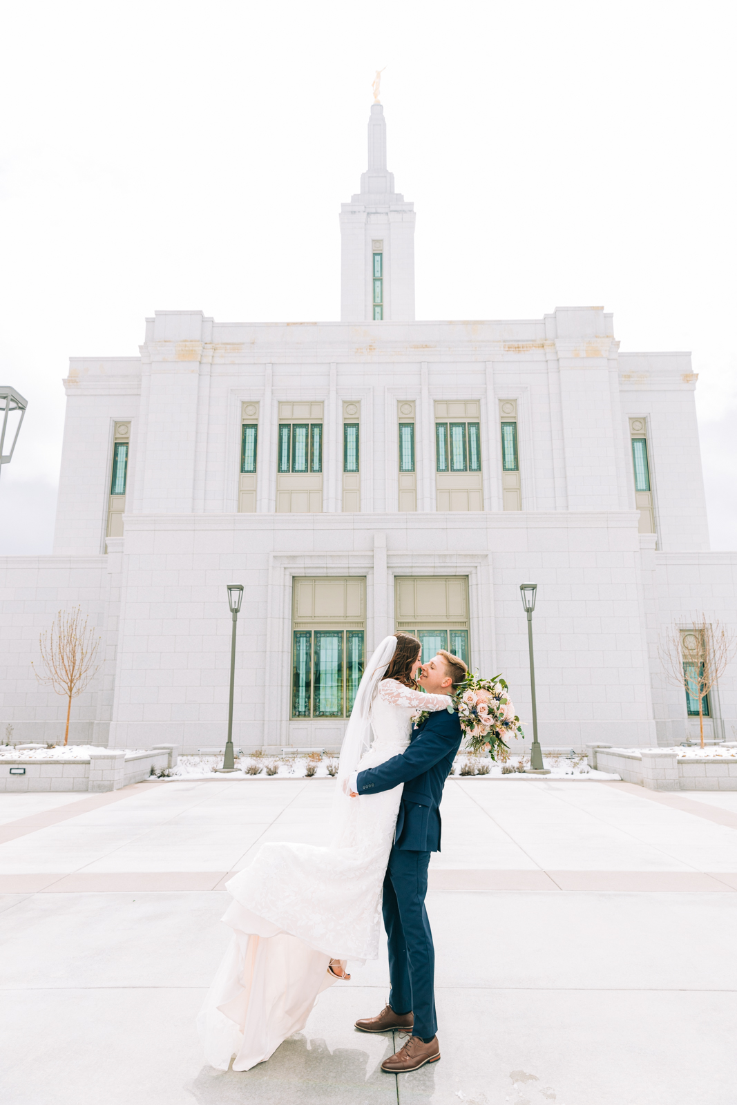 Jackson Hole wedding photographer captures leaping into love bride and groom