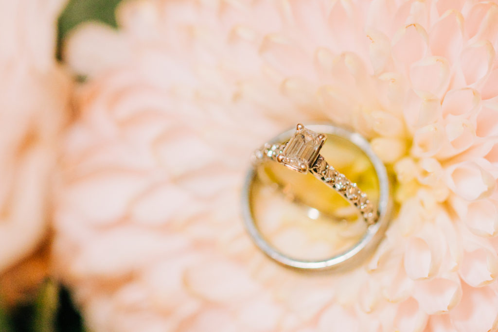 Jackson Hole wedding photographer captures close up of ring on flower