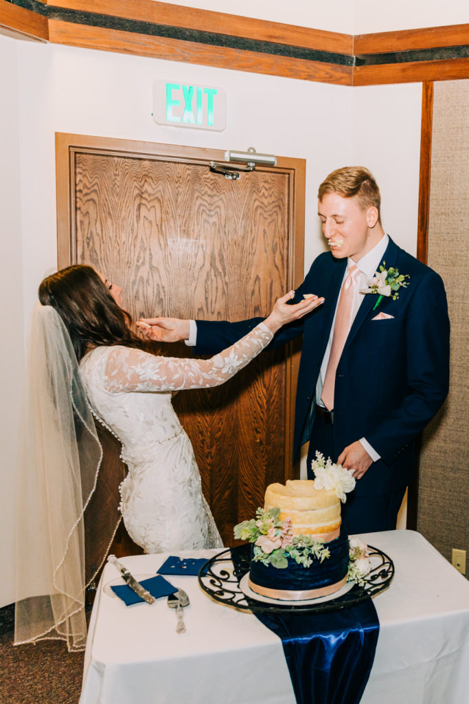 Jackson Hole wedding photographer captures cake smash couple