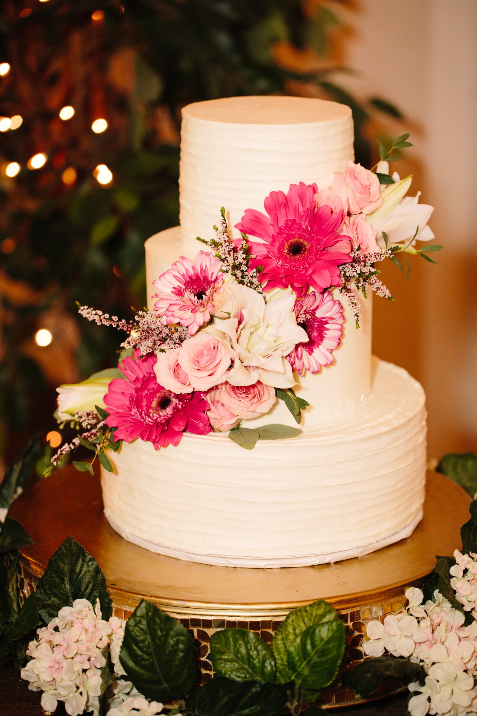 three tier white wedding cake with pink florals from aPocatello wedding bakery