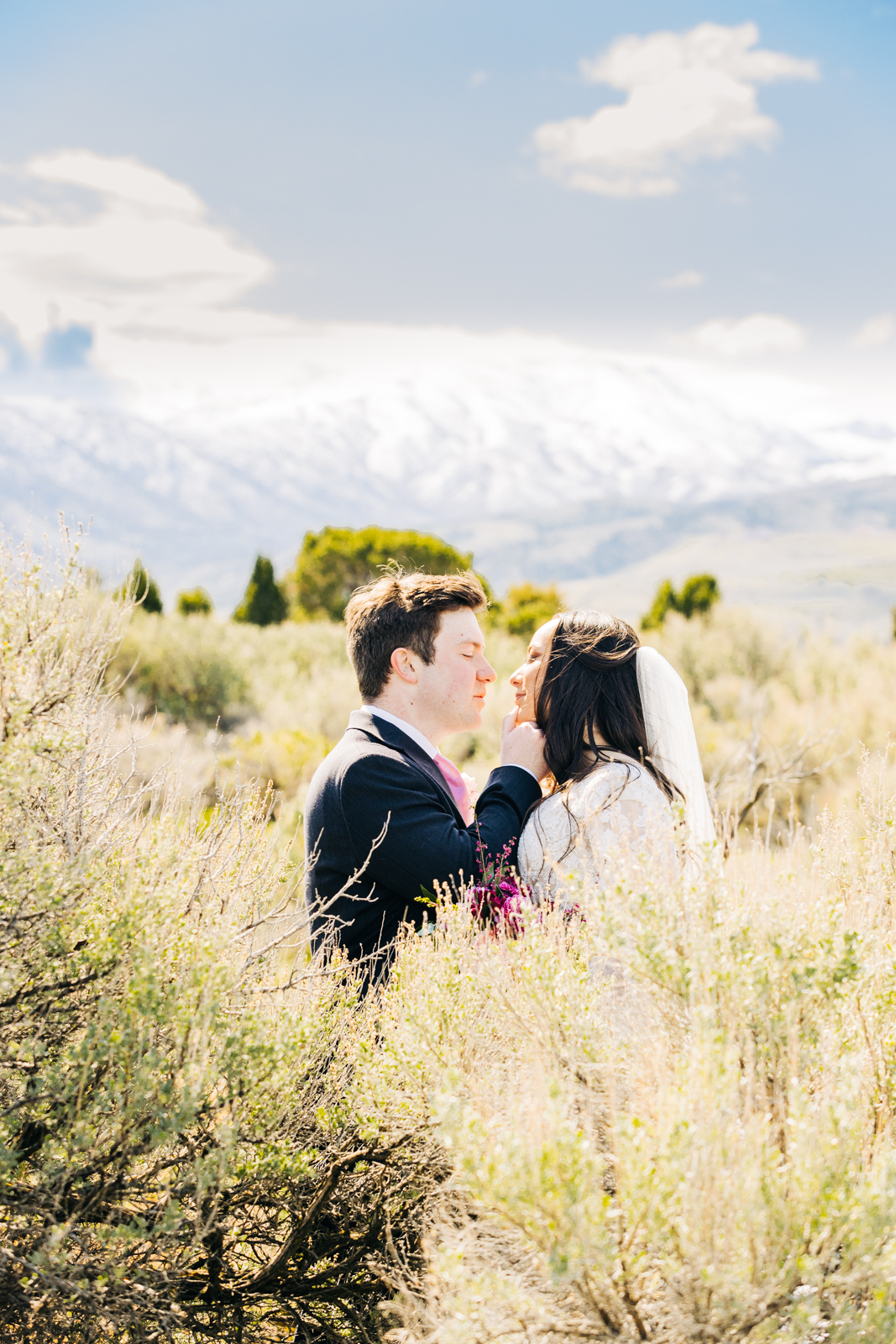 Jackson Hole wedding photographers capture bride and groom gaze into each others eyes at pocatello wedding