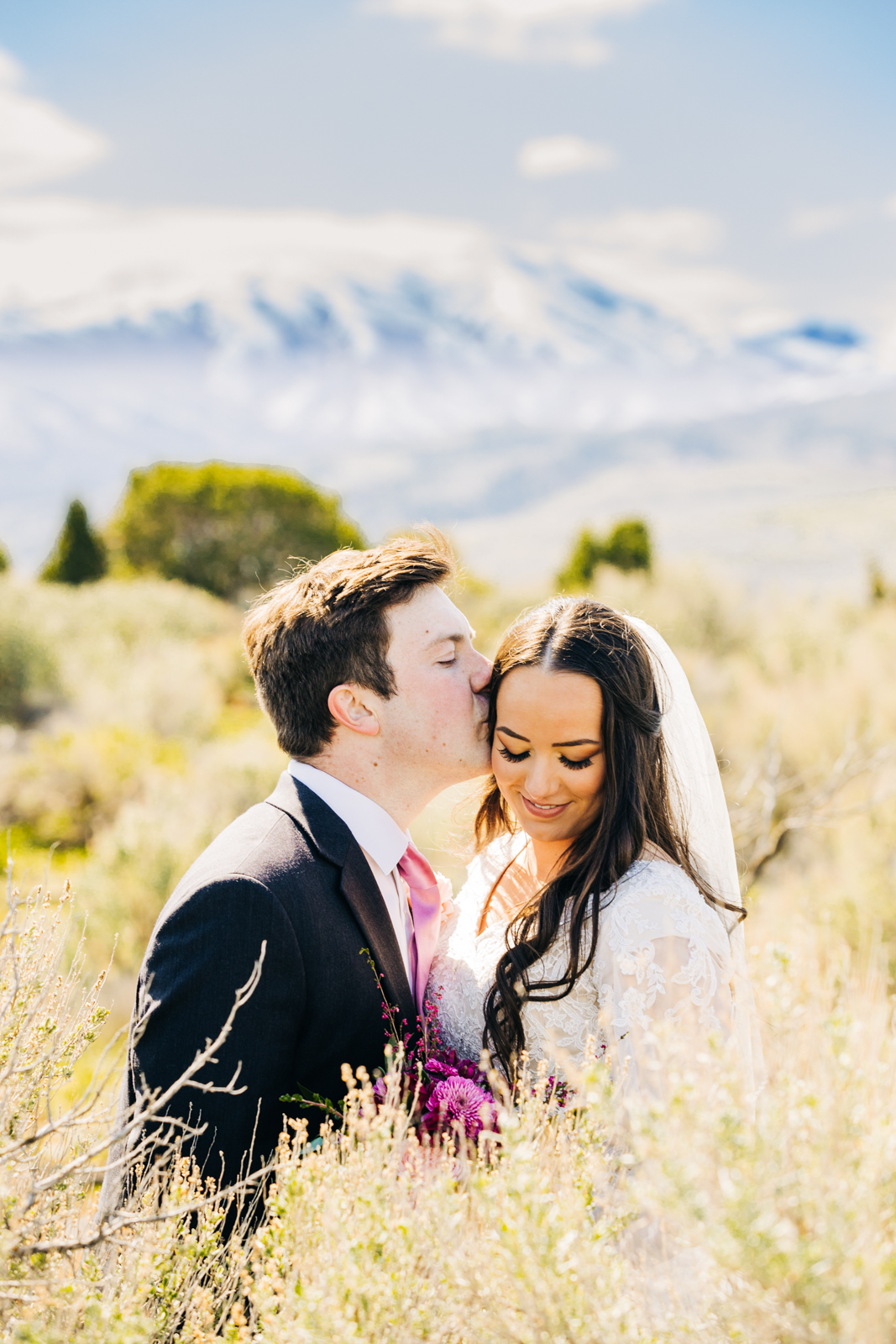 Jackson Hole wedding photographer captures couple is close and kissing at jackson hole wedding