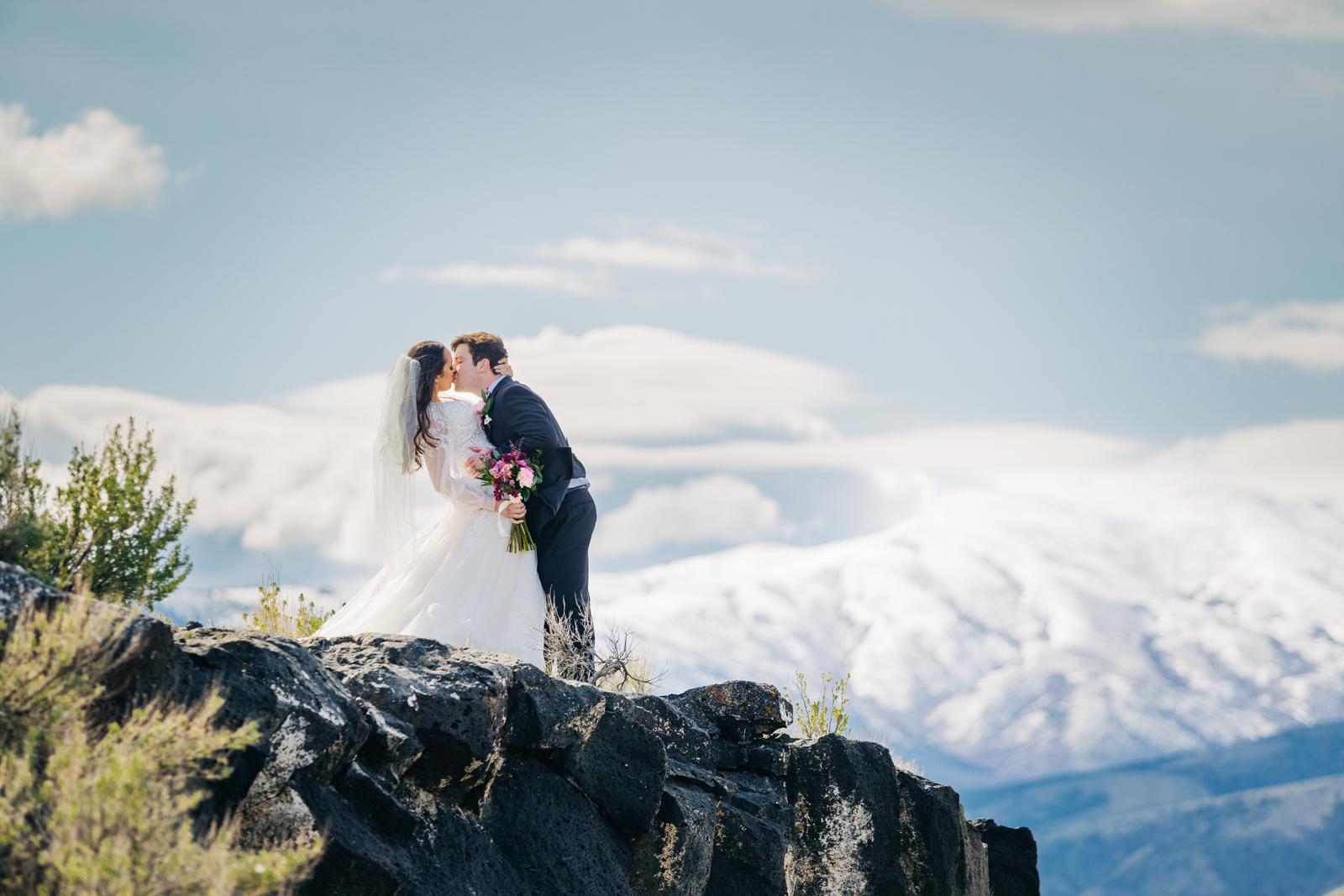 Ethereal pocatello bridals with bride and groom on cliff