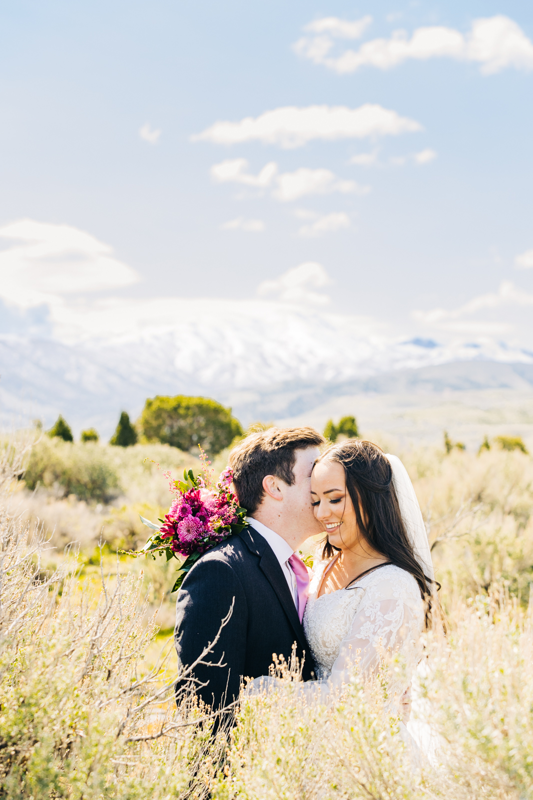Jackson Hole wedding photographers capturecouple in sagebrush after wedding pocatello idaho