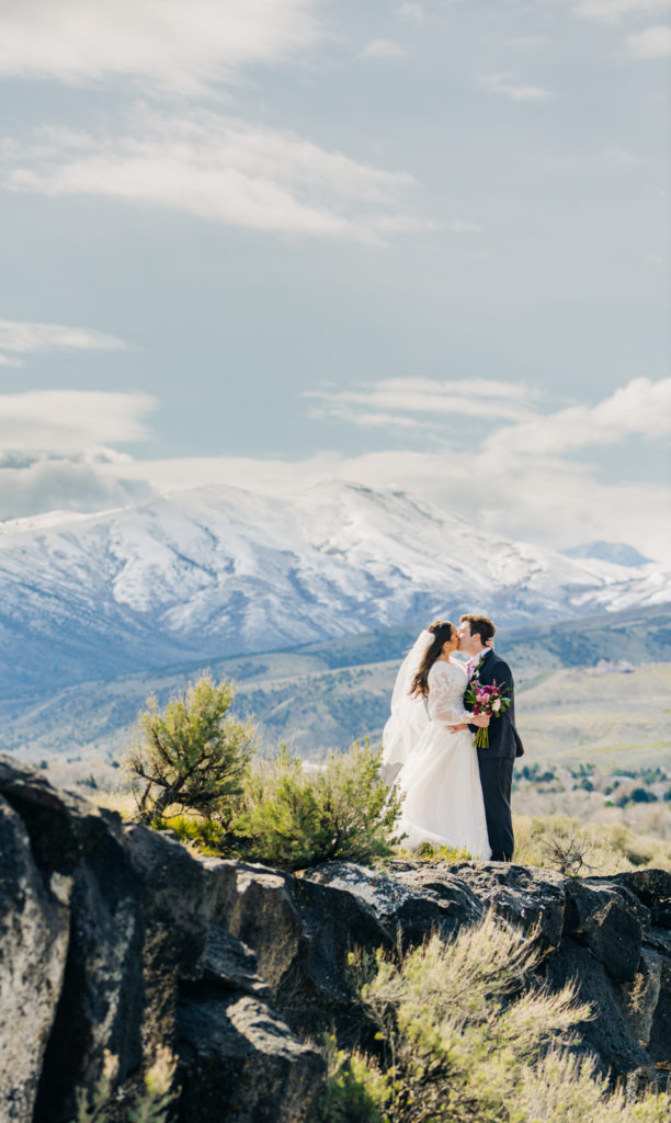 Jackson Hole wedding photographer captures bride and groom embrace jackson hole wedding in mountains