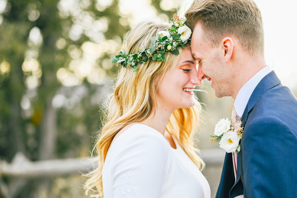 bride and groom noses touching during portraits