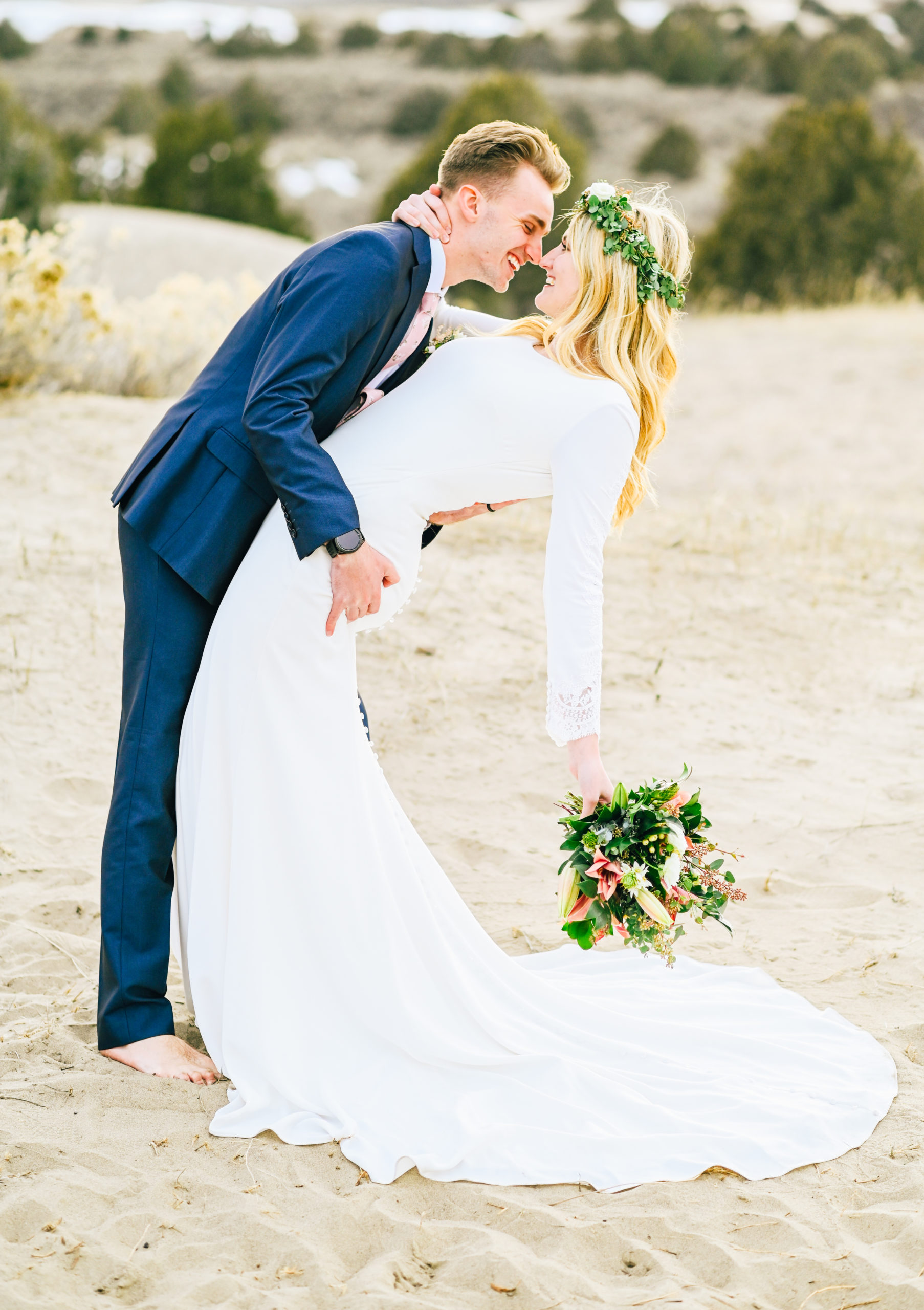 groom dipping bride and kissing her