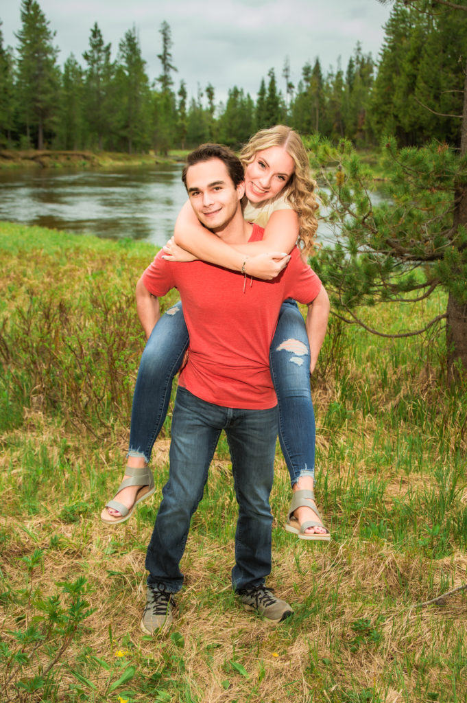 woman on man's back during fun Island Park engagement session