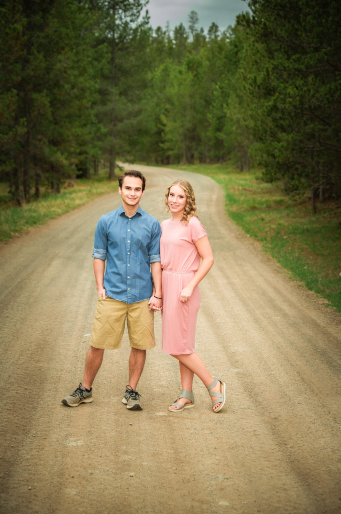 couple standing together in road during outdoor engagement session