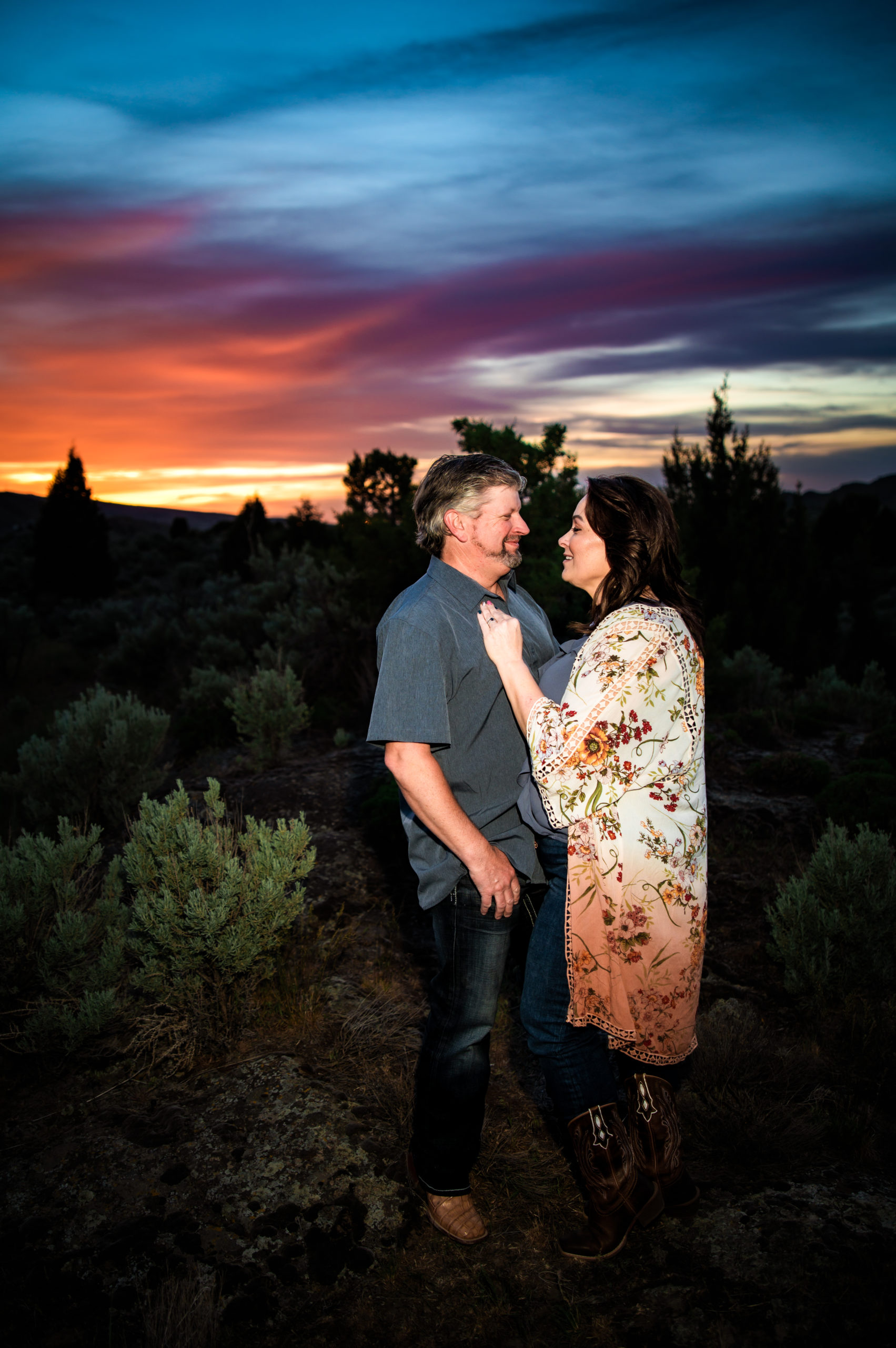 man and woman hugging at sunset portraits