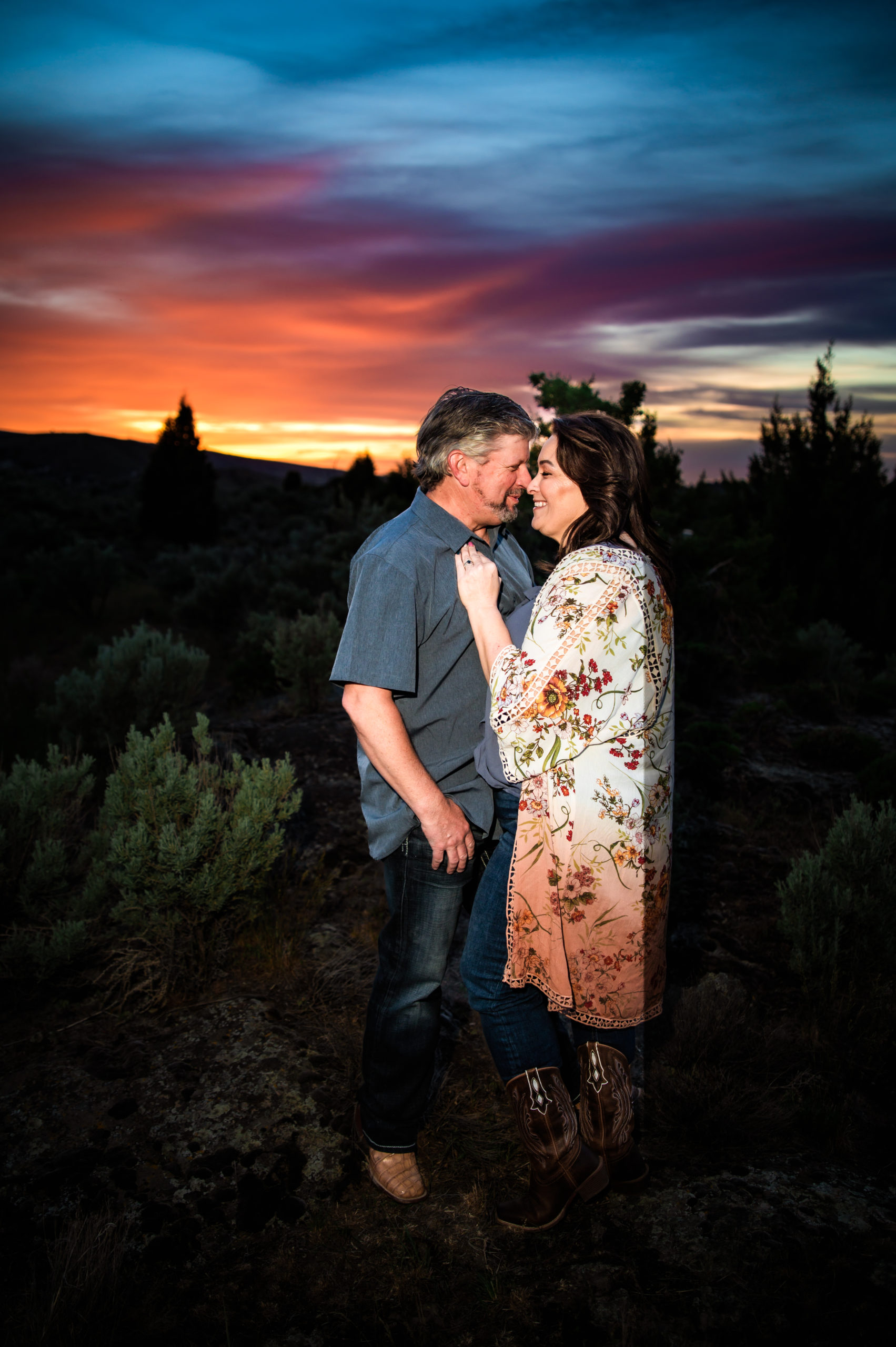 couple touching noses together during sunset engagement portraits