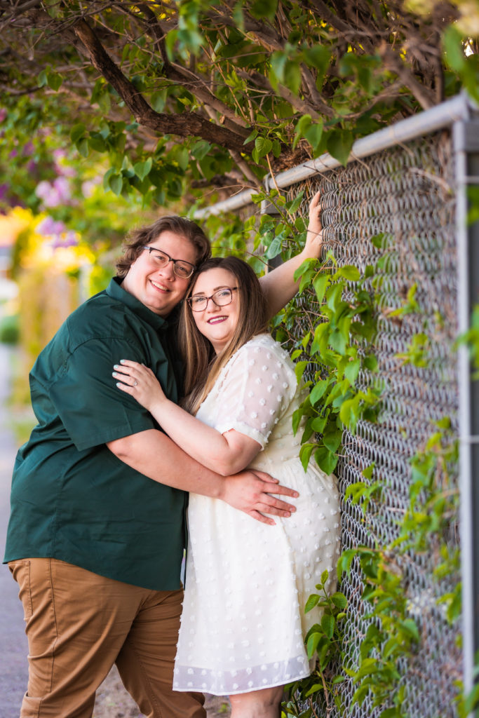 man and woman leaning against fence during lively pocatello engagements