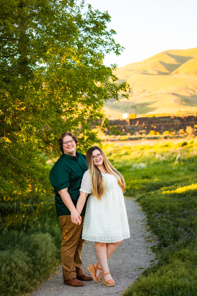 Jackson Hole wedding photographer captures couple holding hands during engagement photos
