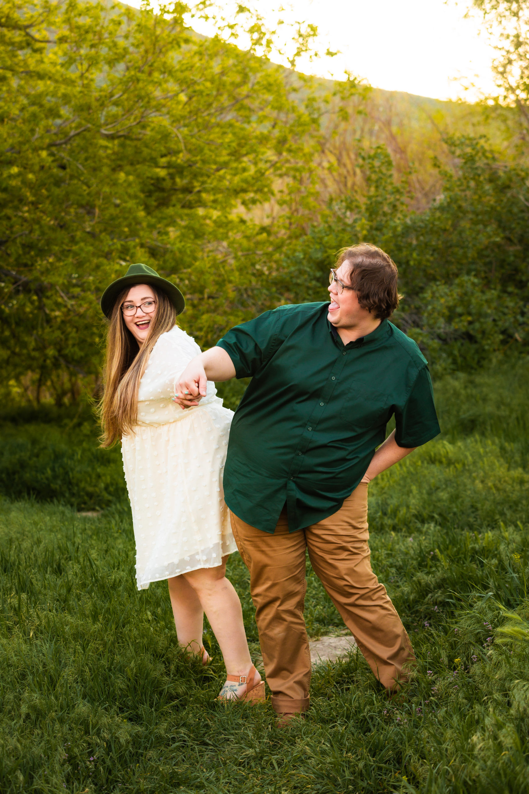 couple bumping hips during engagements
