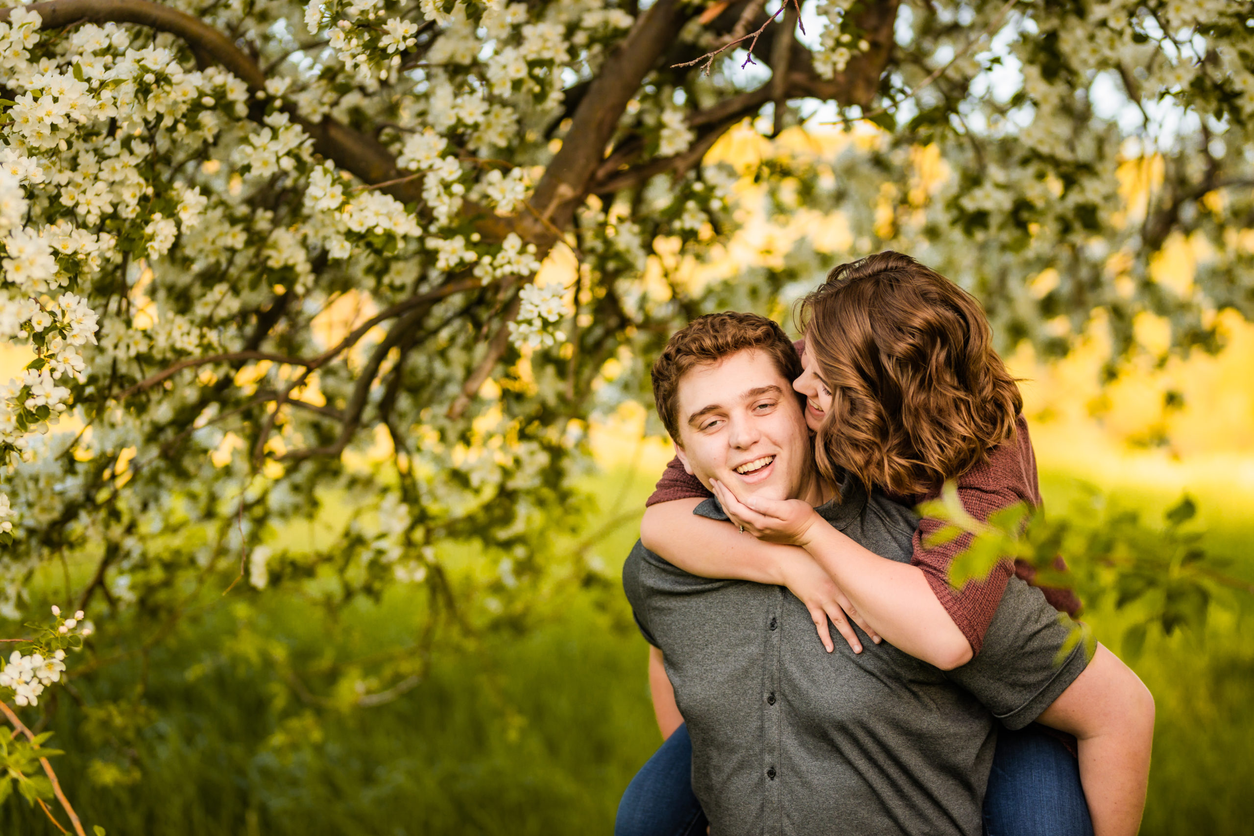 woman on man's back during engagement session