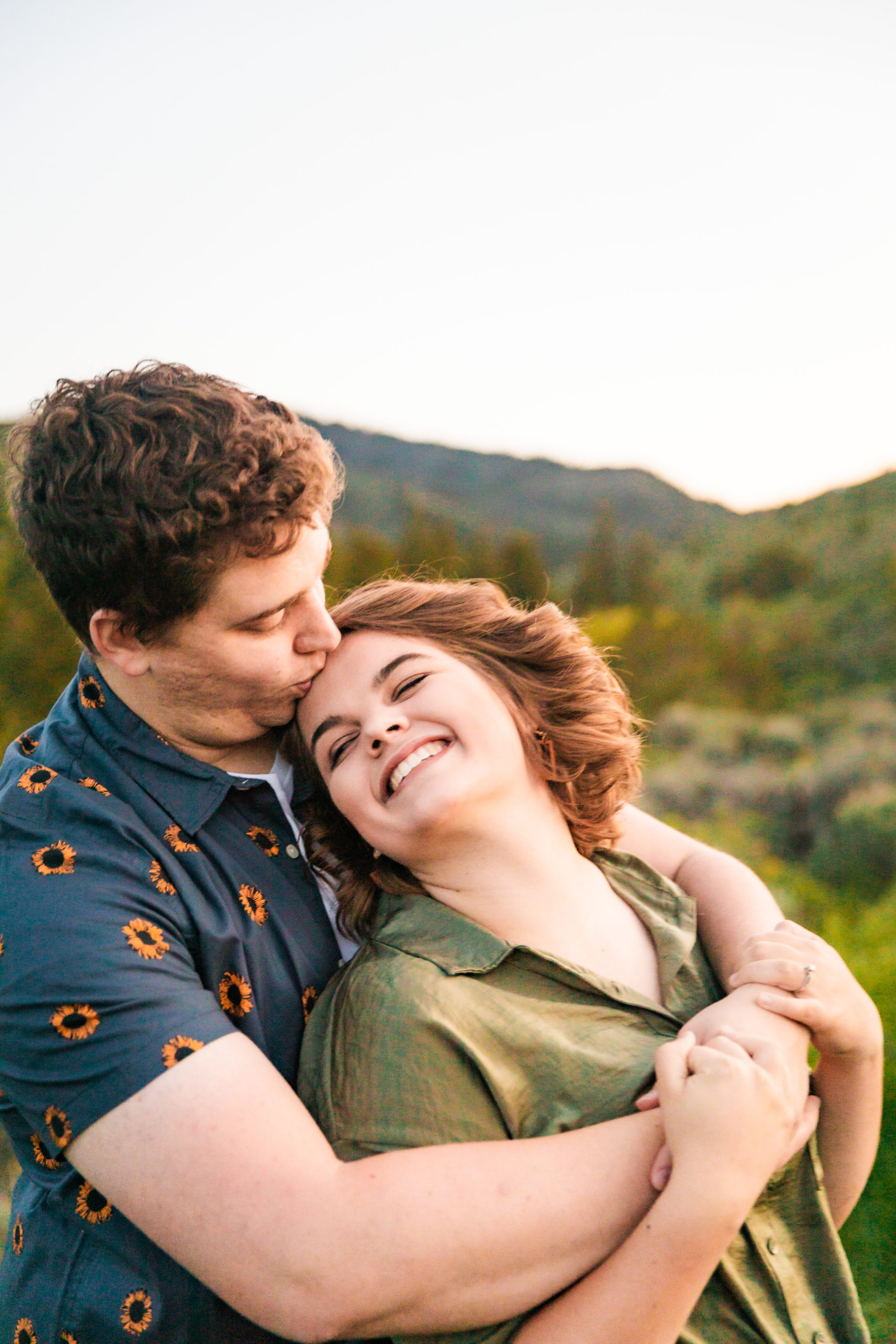 woman leaning against man's back smiling
