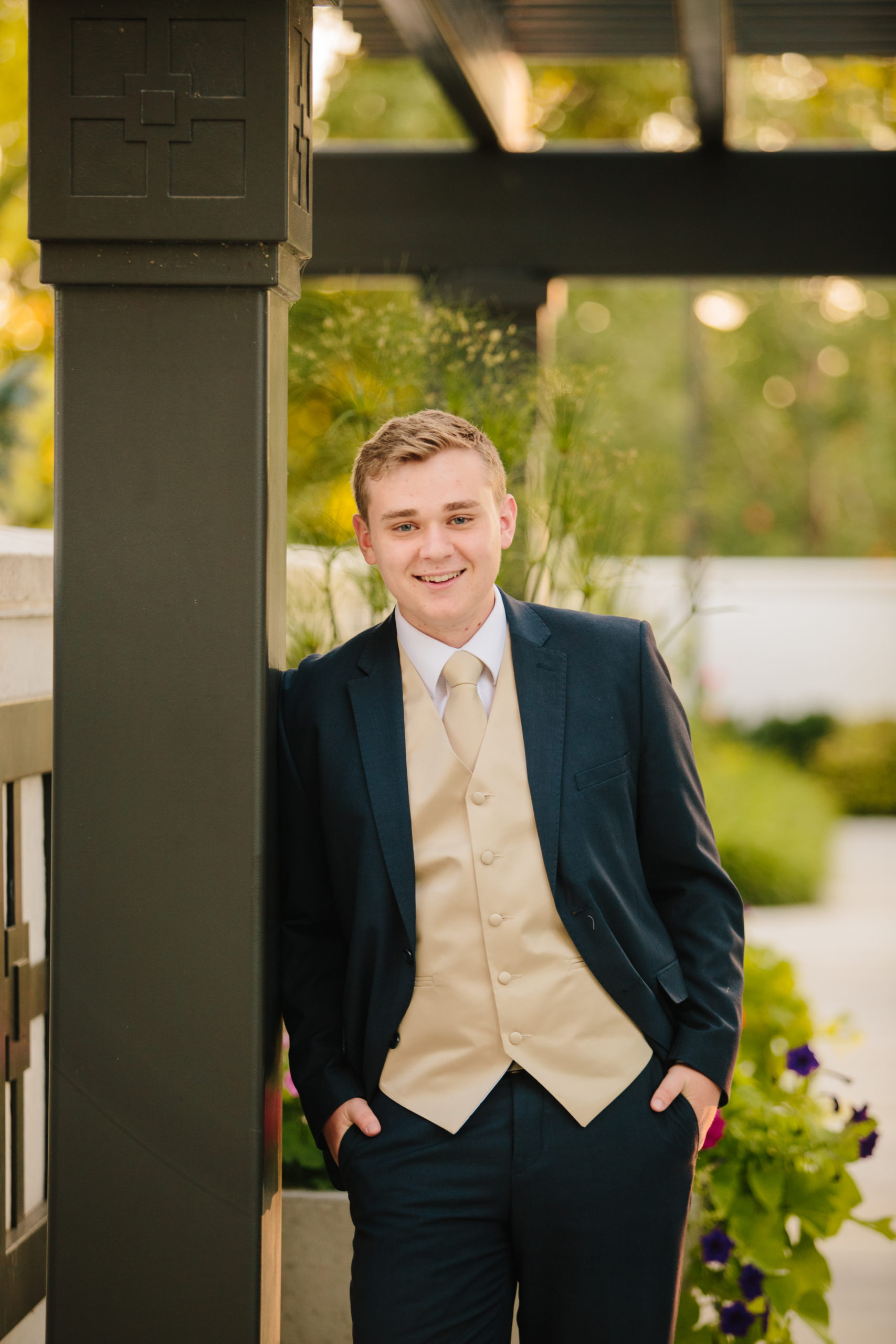 groom leaning against arbor at idaho falls temple sealing