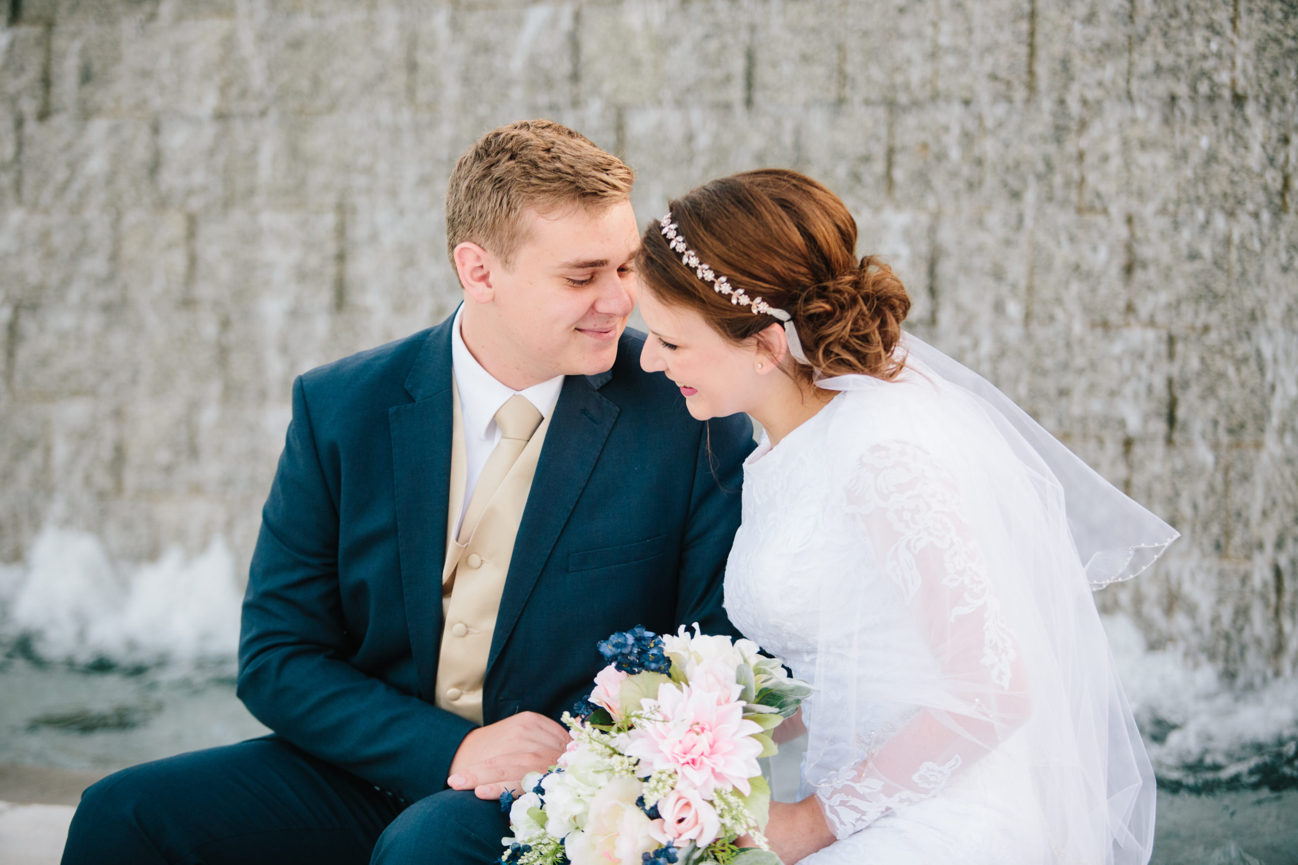 bride and groom at fountain at idaho falls temple Idaho Falls Temple Wedding Tips