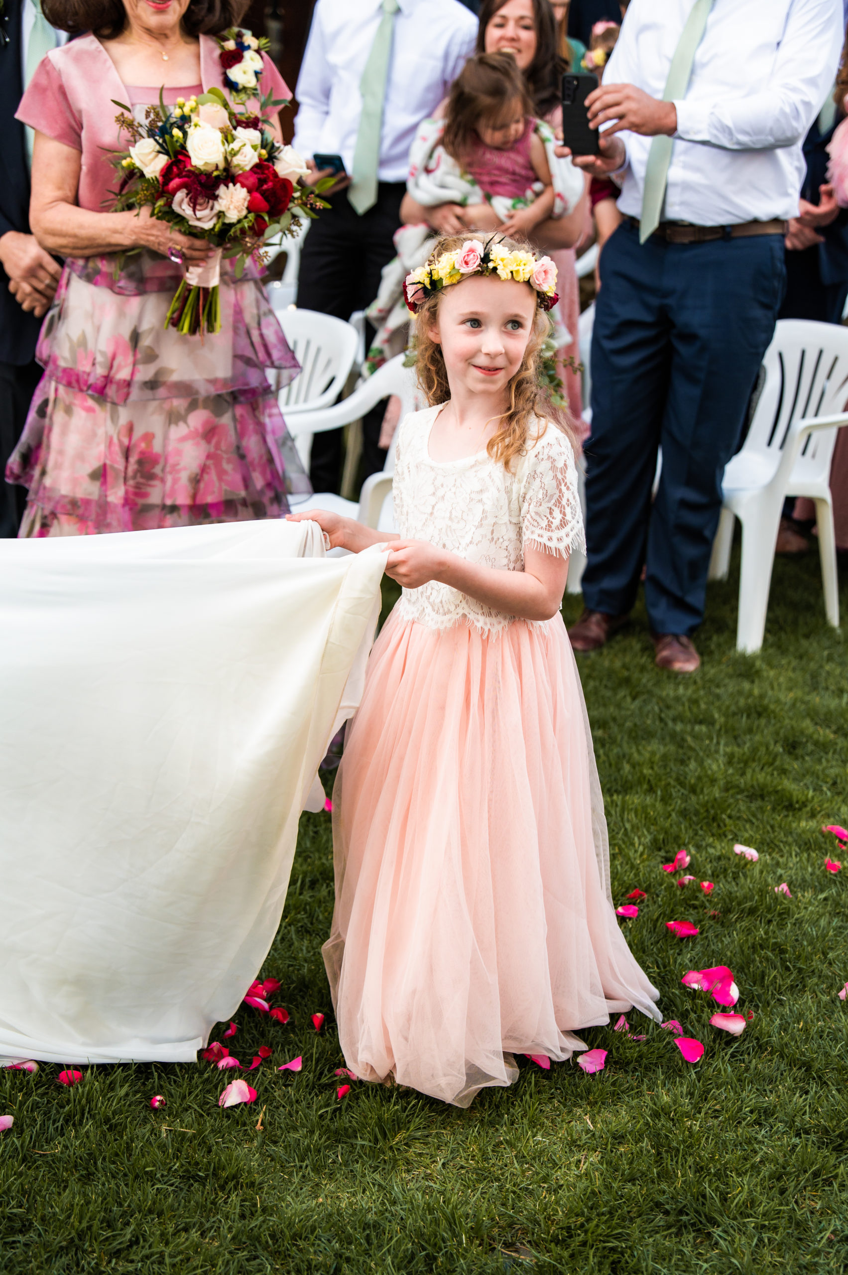 little girl holding brides dress idaho falls wedding