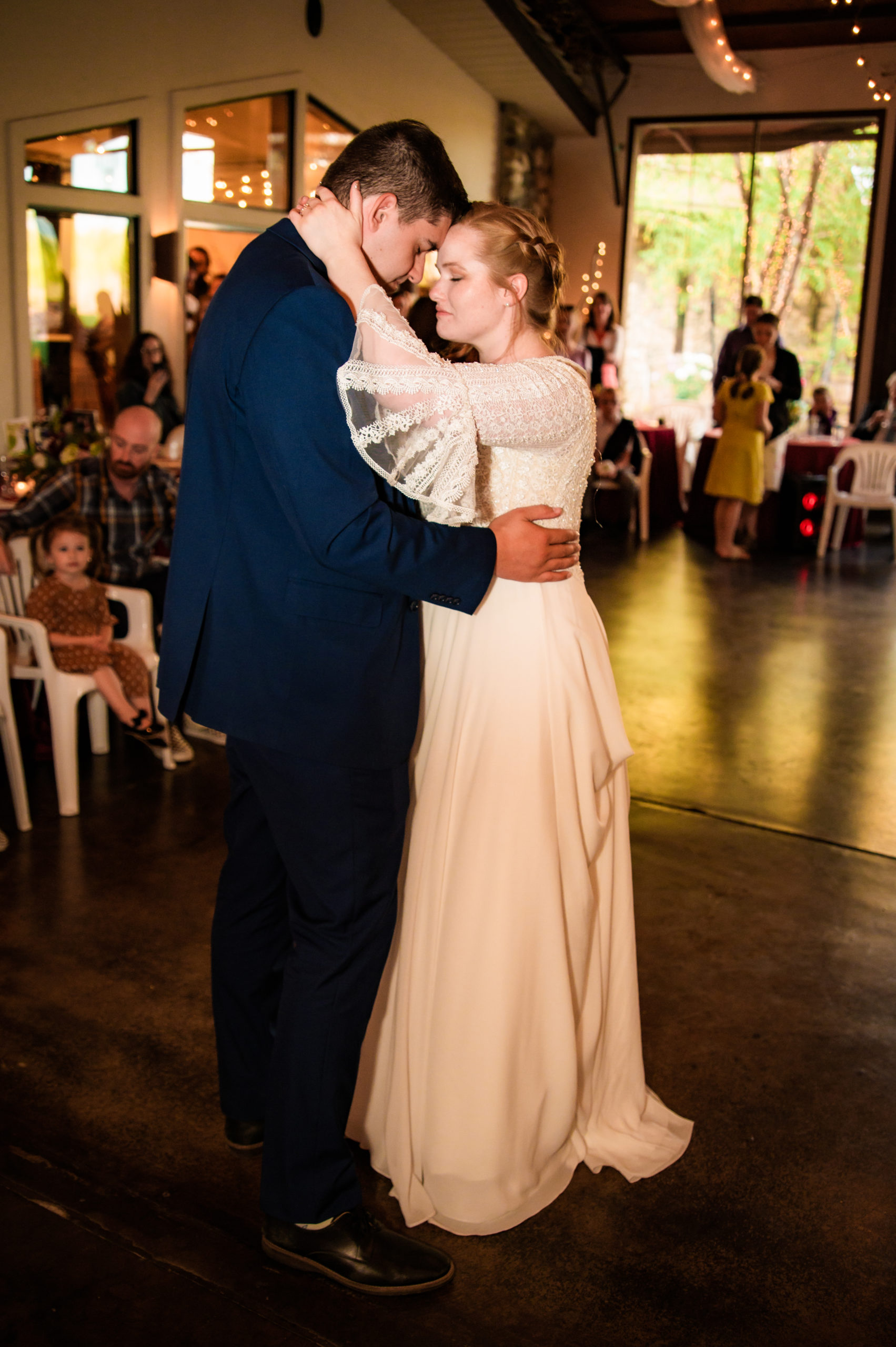 bride and groom embrace in love