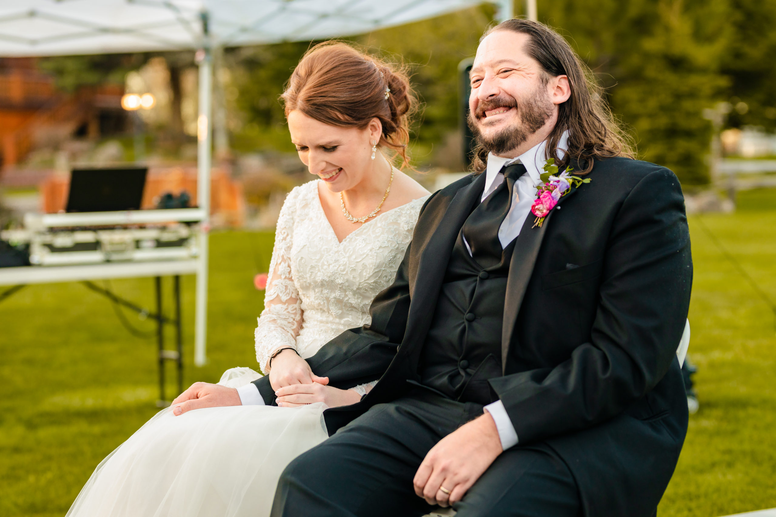 couple laughing together during Colorful LaBelle Lake Reception