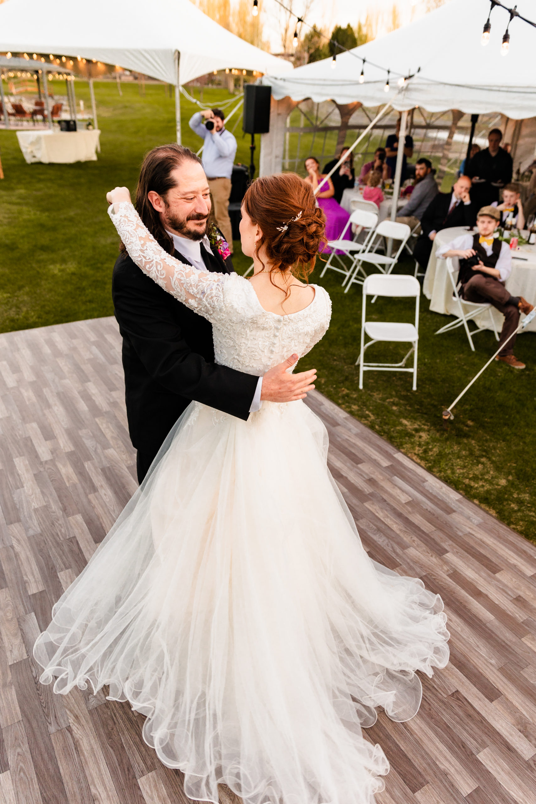 newly married couple dancing together at Colorful LaBelle Lake Reception