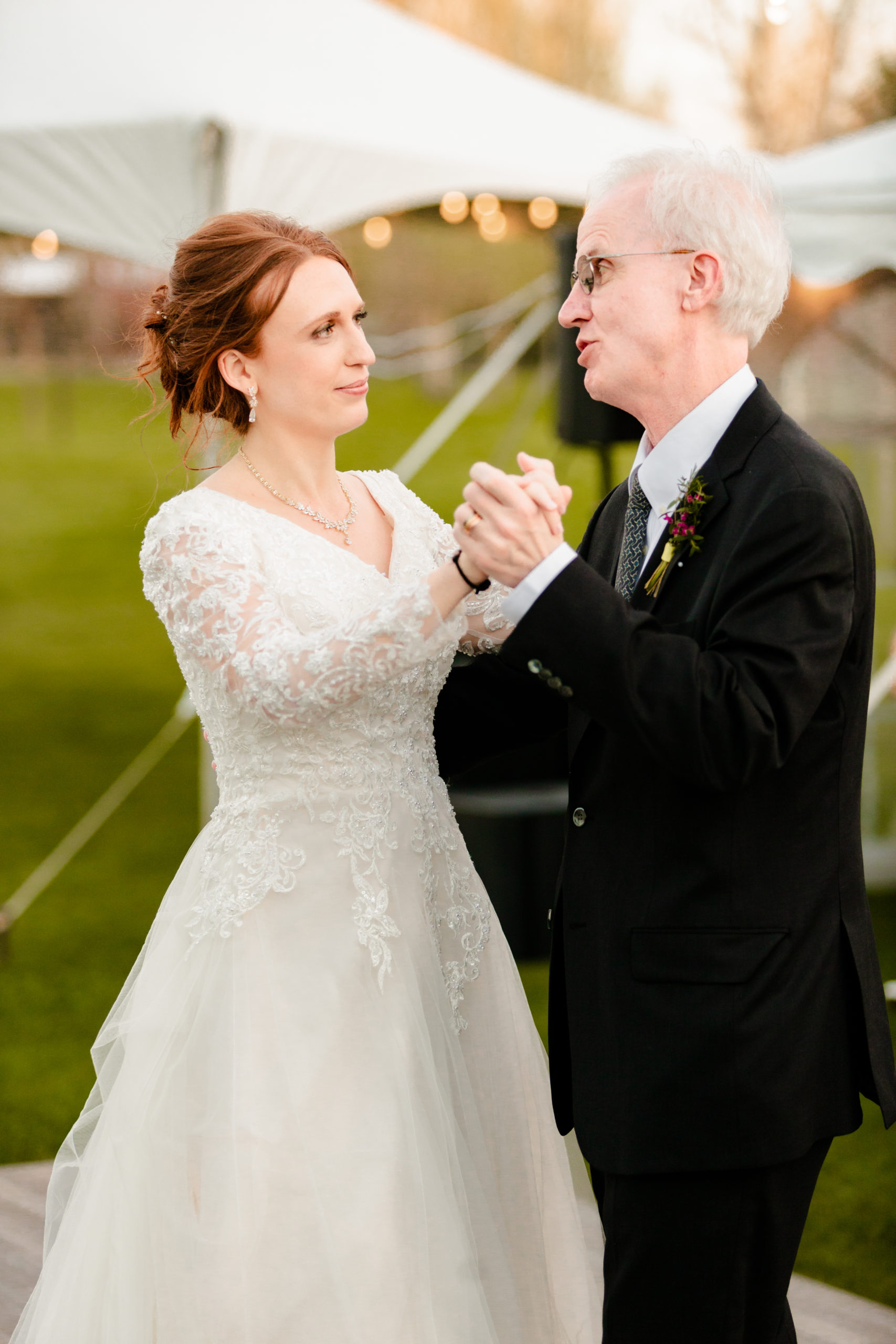 father daughter dance during outdoor reception