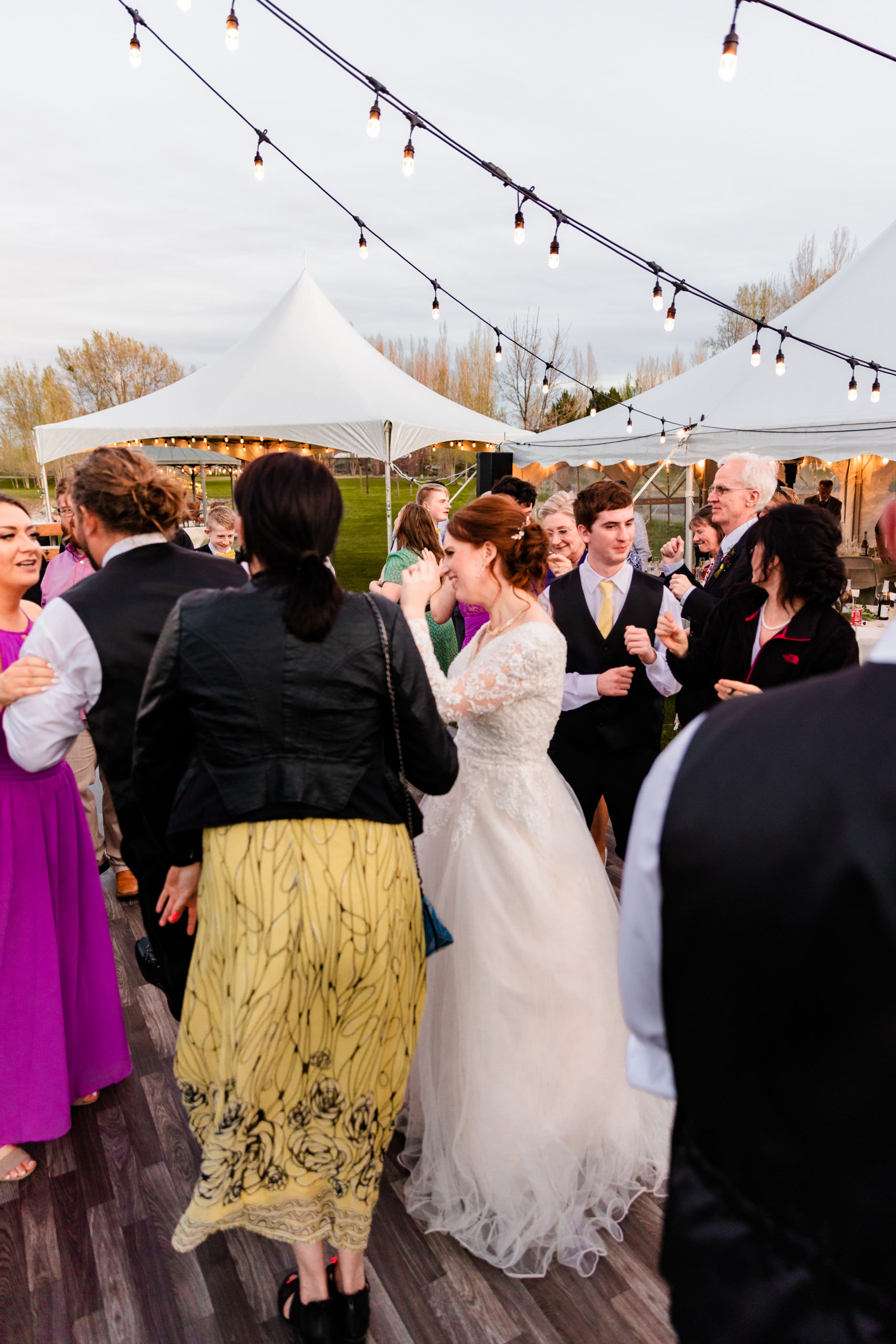 bride dancing with wedding guests 