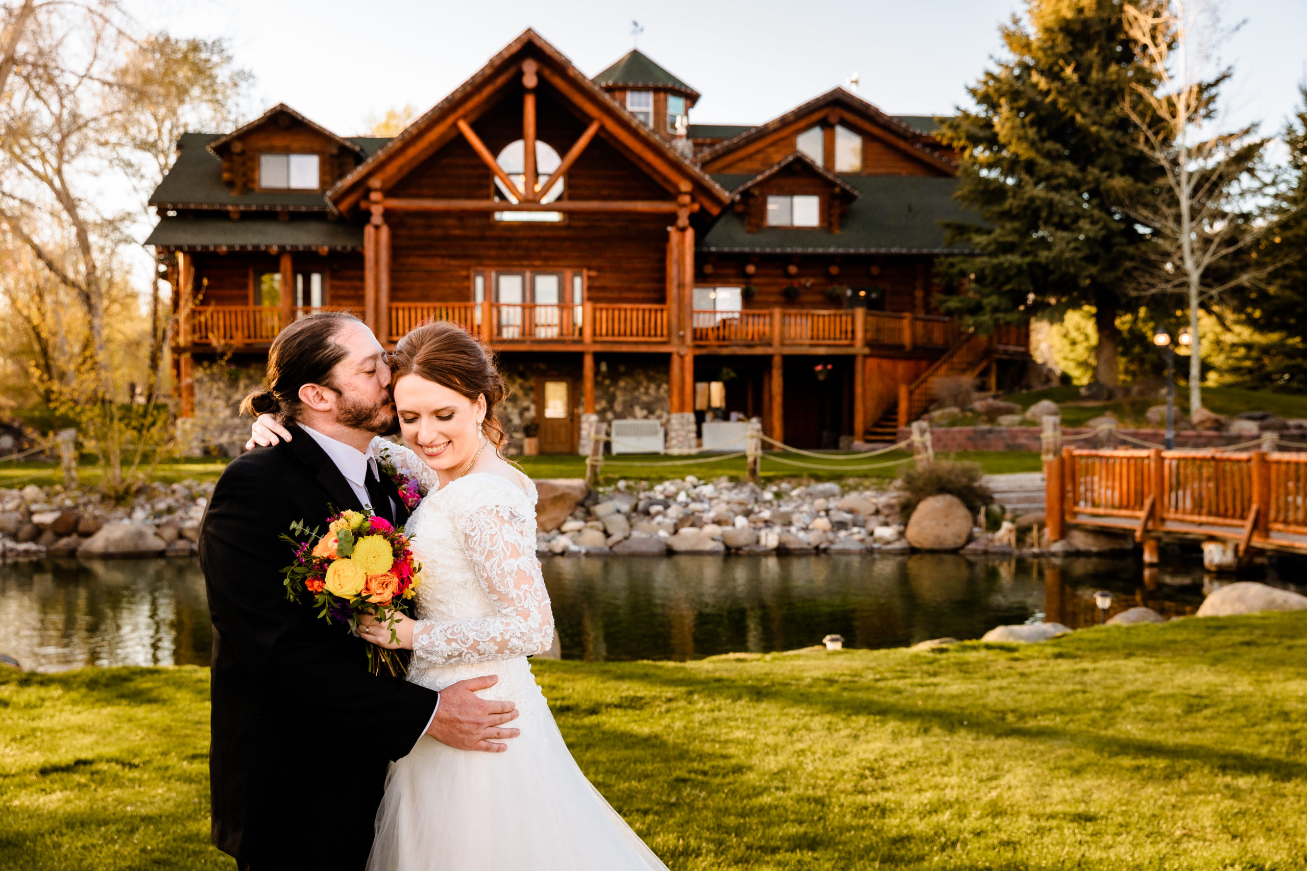 bride and groom embracing during labelle lake wedding