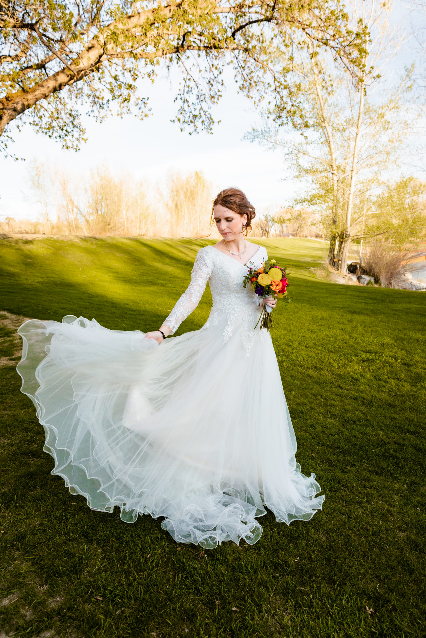 bride spinning with dress before Colorful LaBelle Lake Reception
