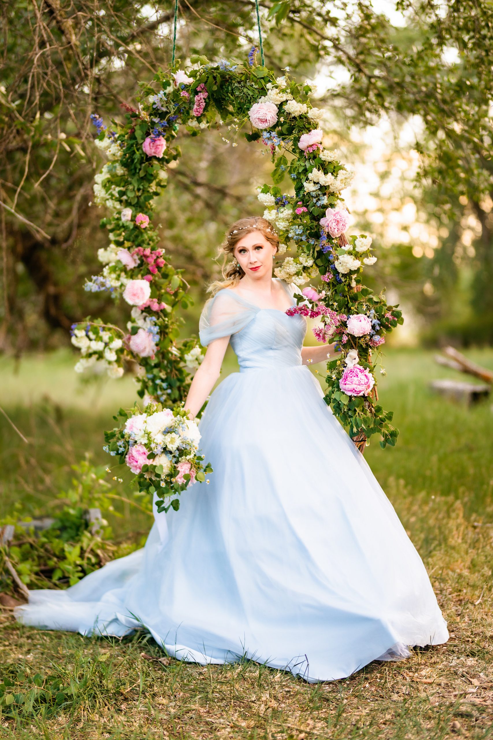 Idaho bride with flower swing with local flowers